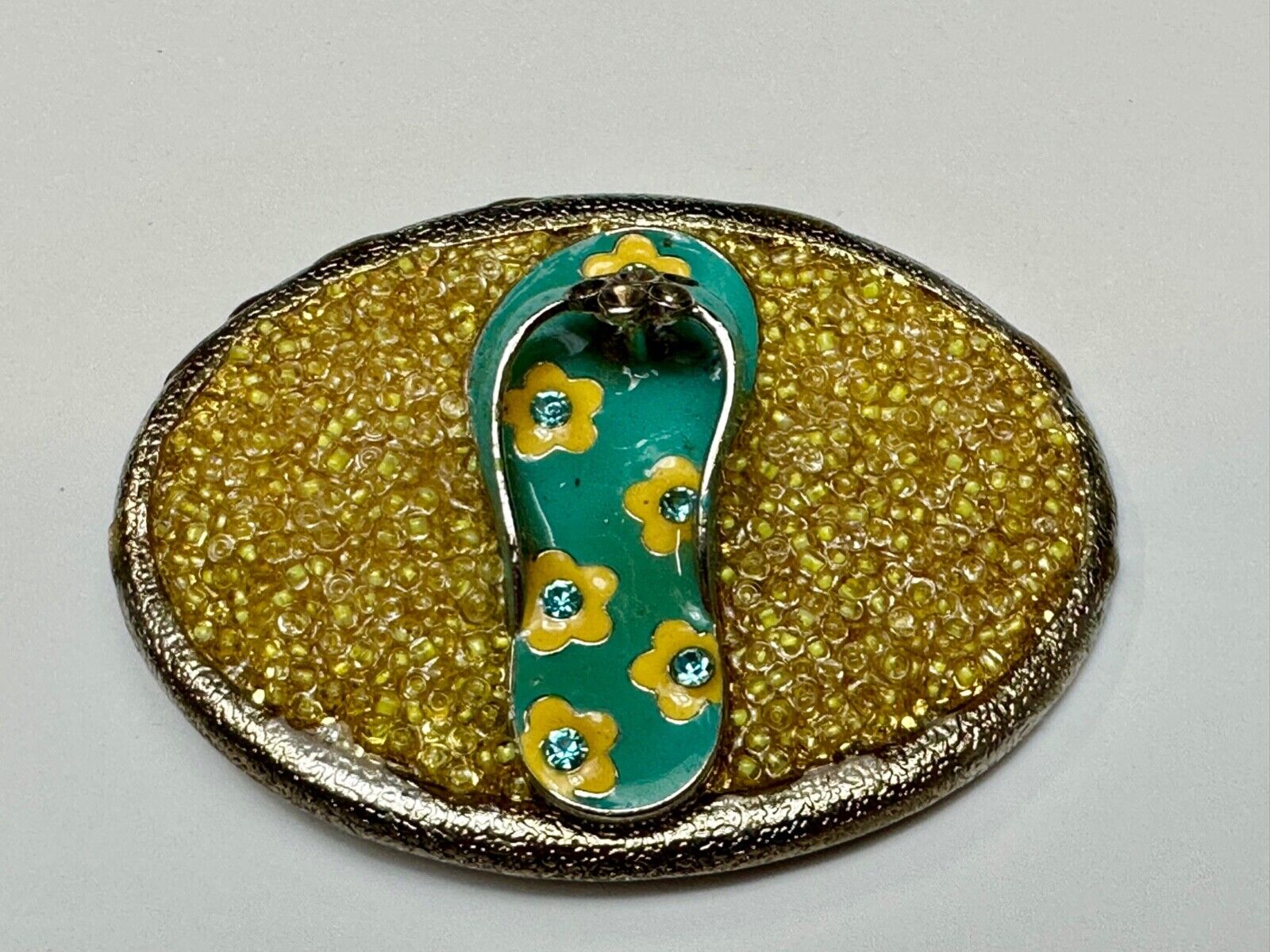 unique flip flop on sand - beach girls artisan belt buckle - missing stones?