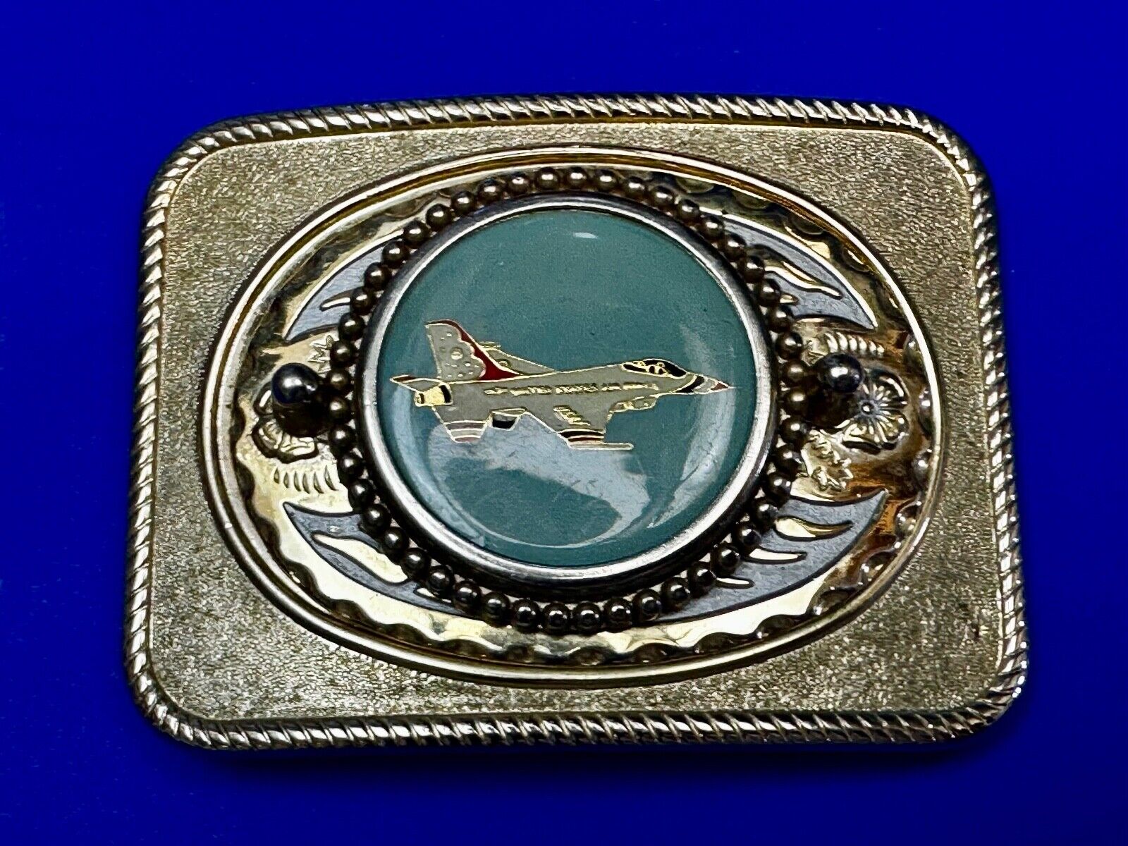 Us Air Force Fighter Jet as centerpiece in western Belt Buckle - or dollar coin