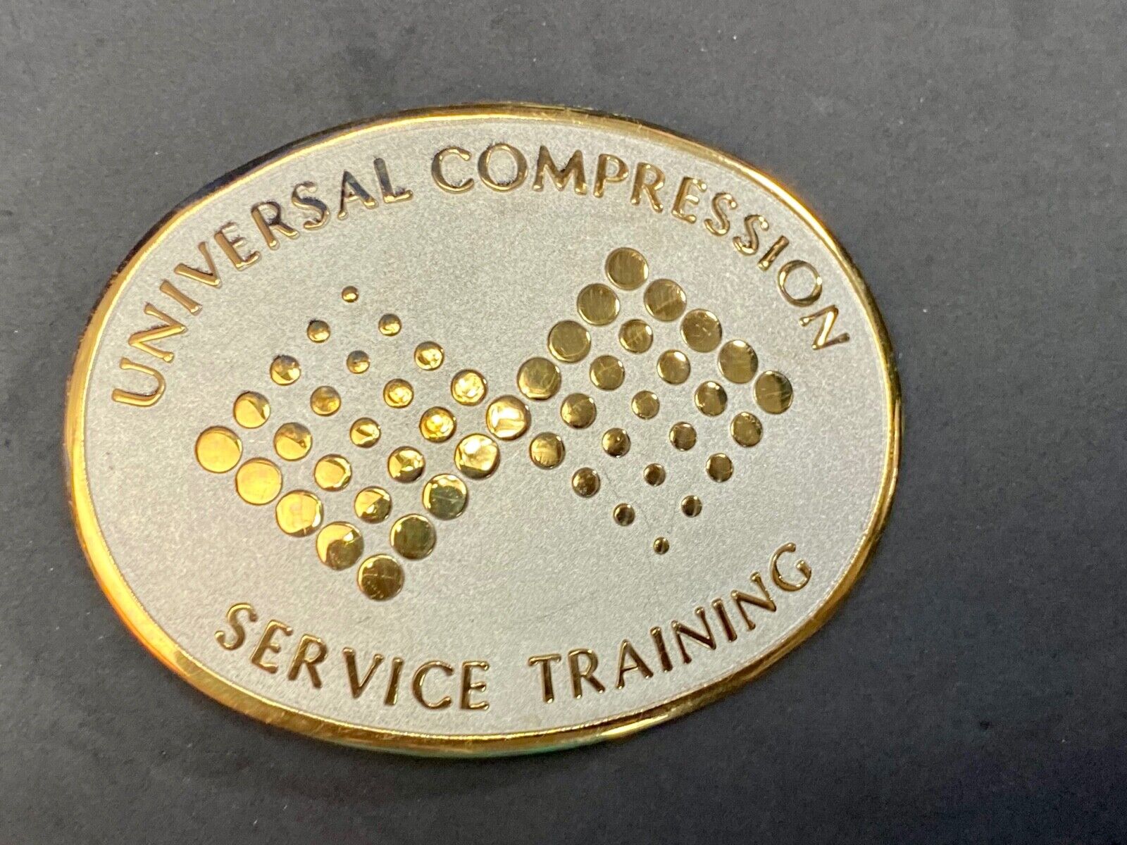 Universal Compression Service Training Company Award Belt Buckle