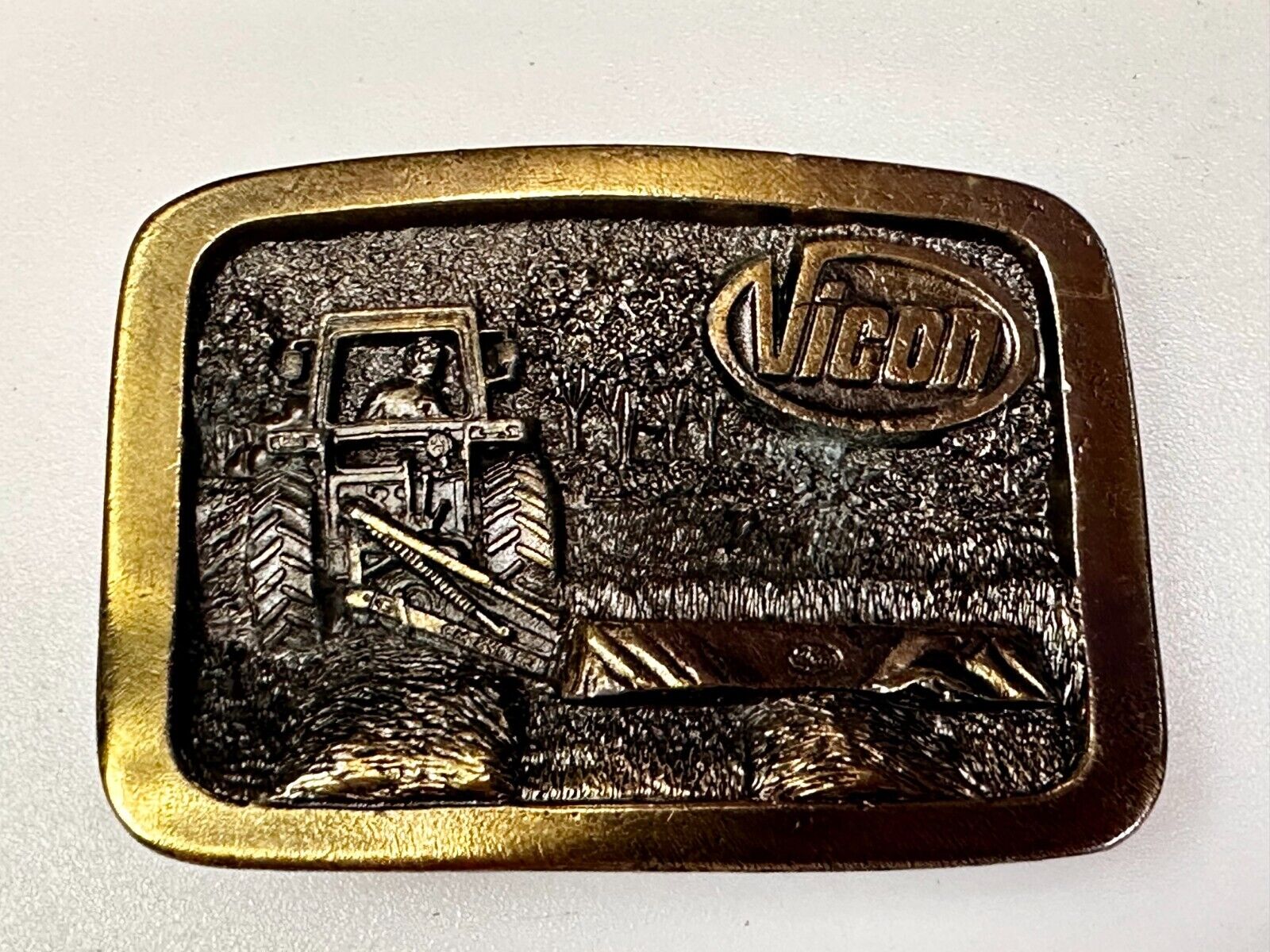 Vicon Disk Mower Tractor Promotional Belt Buckle by Premium Specialties
