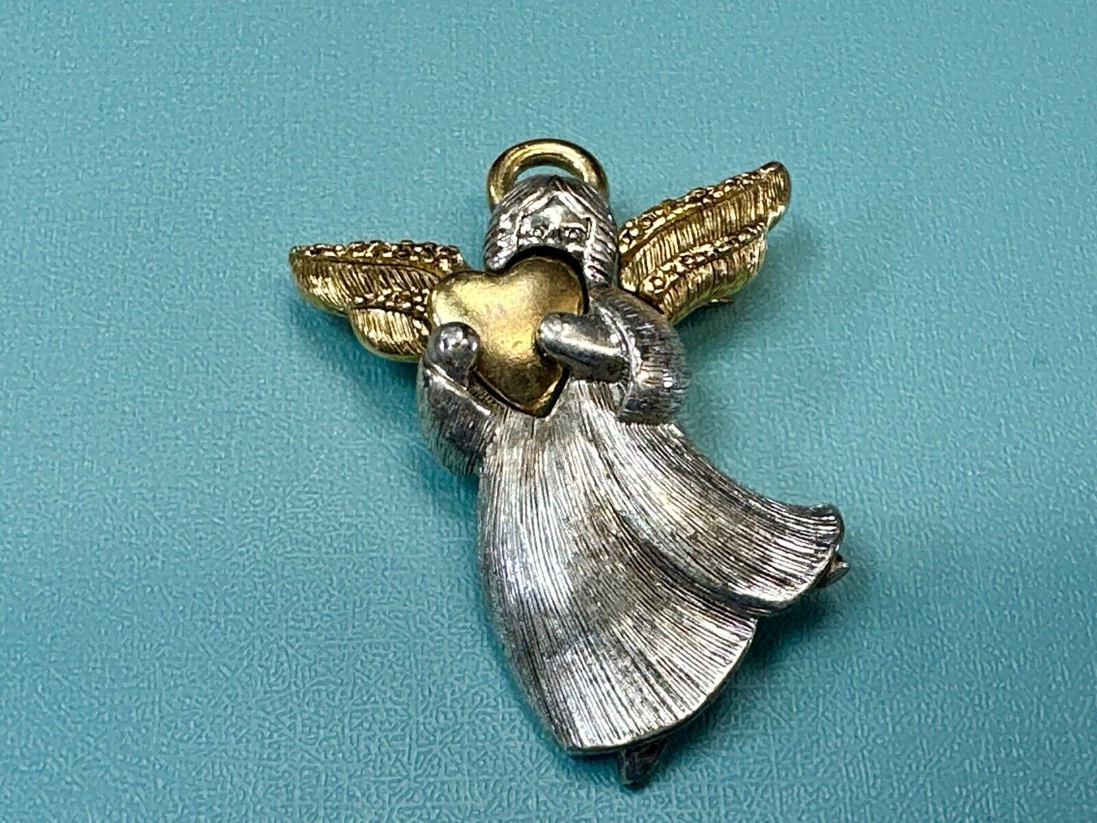 Angle holding heart -vintage two tone LC Liz Claiborne Signed Brooch Pin