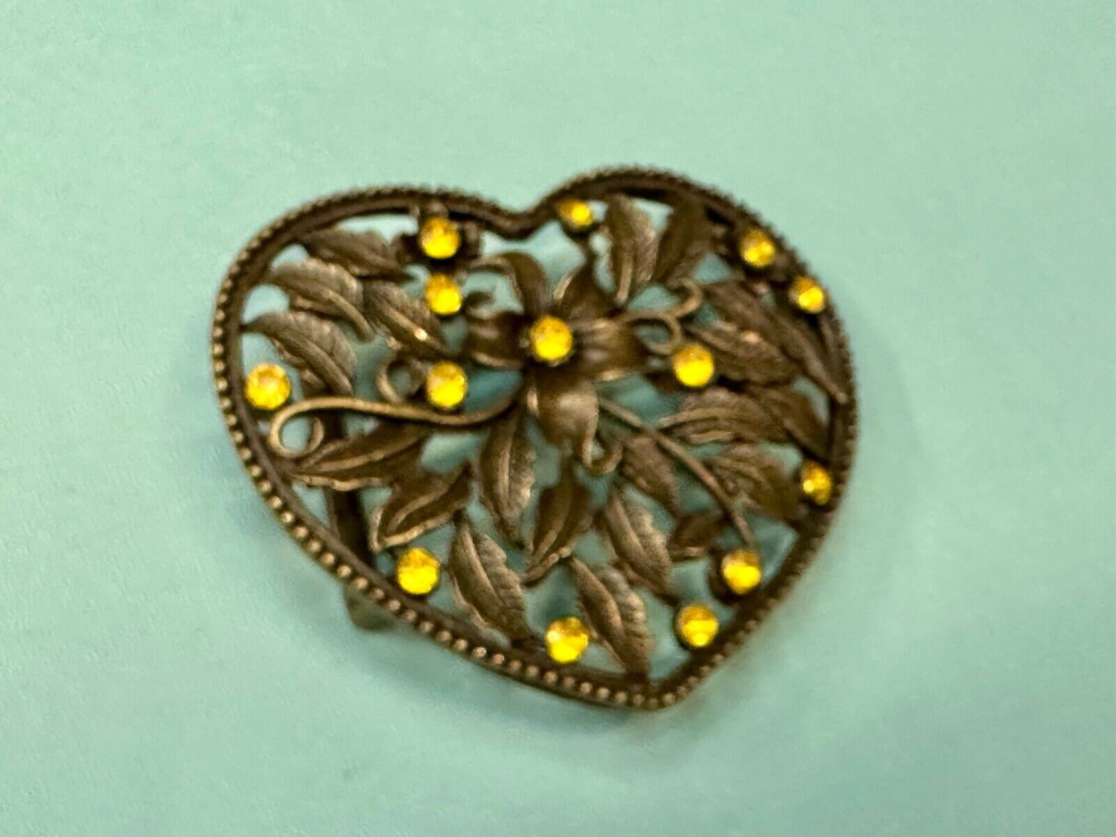 Beautiful see through Heart shaped belt buckle with yellow rhinestone accents