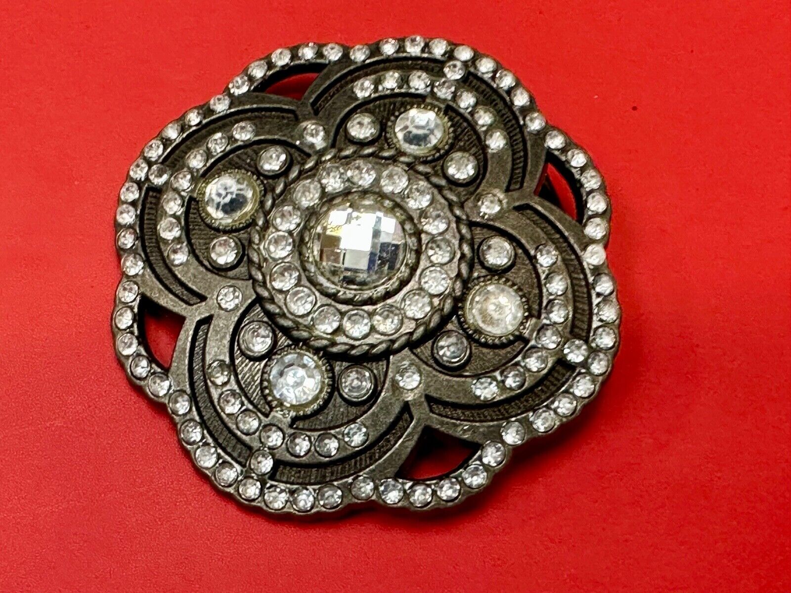 Beautiful Rhinestone accented see through flower shaped cutout belt buckle