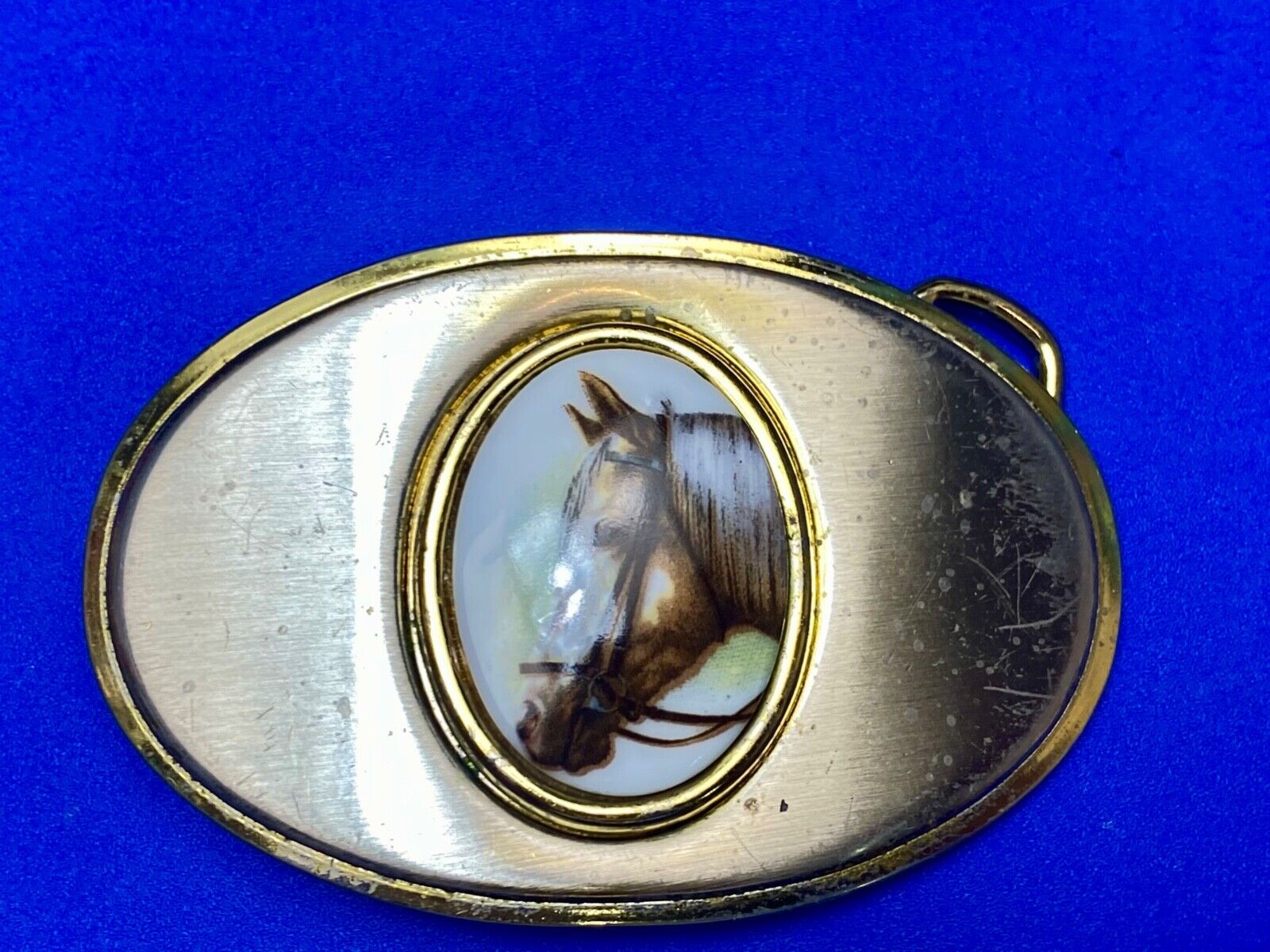Vintage horse head picture centered in western belt buckle