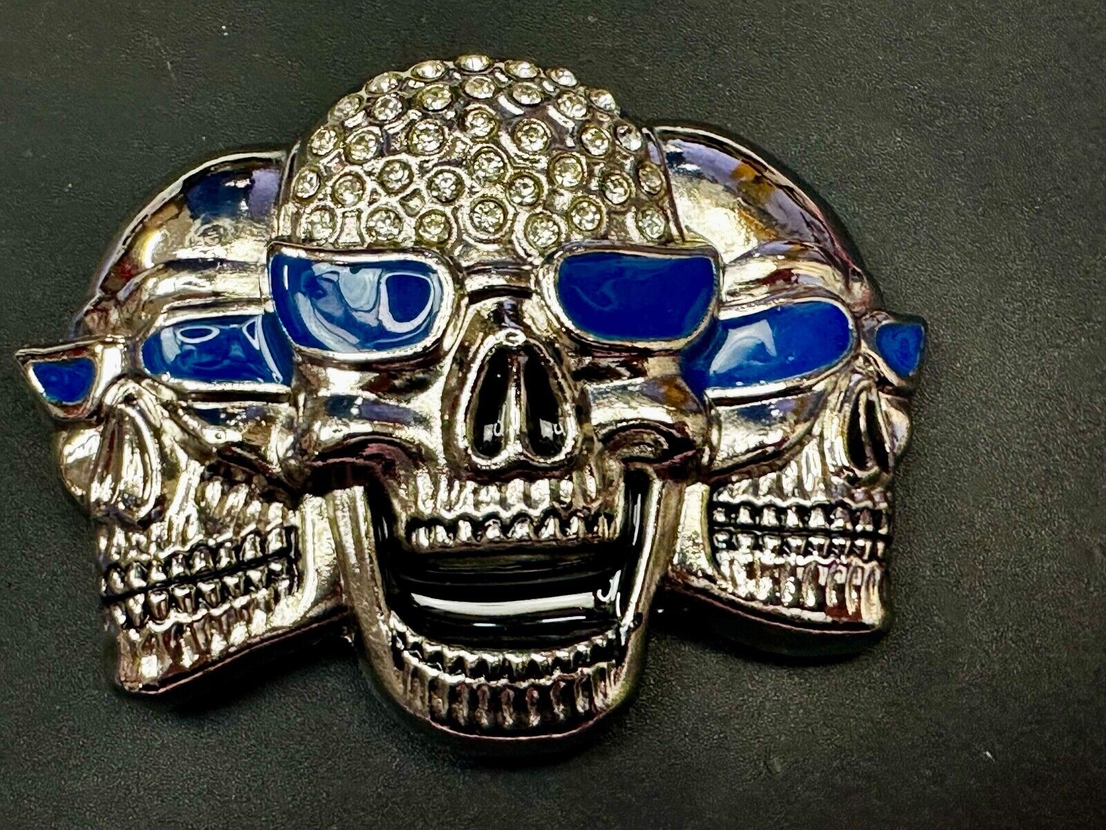Three Skull's Heads Rhinestone Accented W/ Blue Shades Silver Tone Belt Buckle