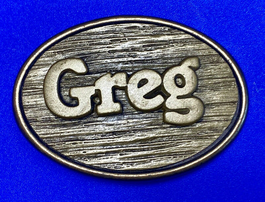 Vintage GREG name metal wood grain western Belt Buckle By Oden - Made In USA