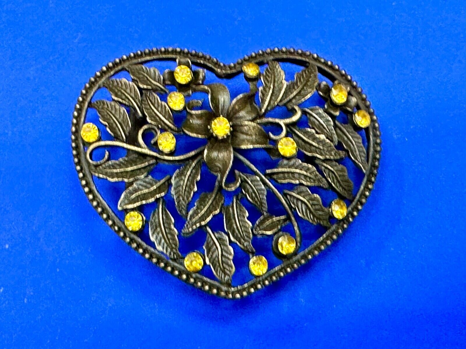 Beautiful see through Heart shaped belt buckle with yellow rhinestone accents