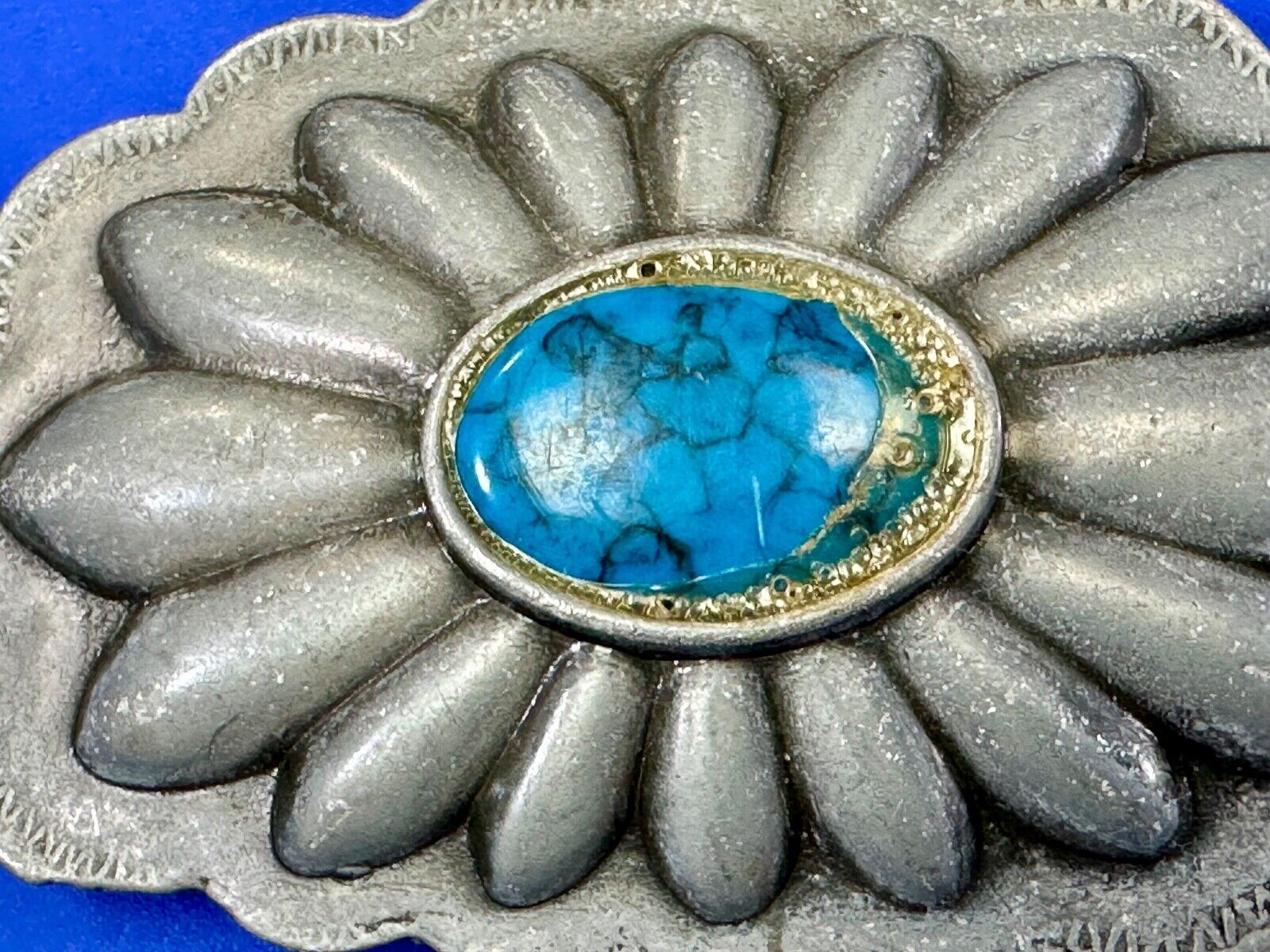 Turquoise stone centered on Vintage metal flower theme belt buckle