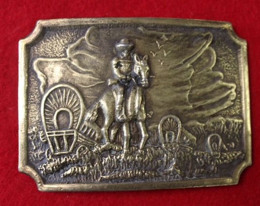 Vintage belt buckle, Covered wagon's  and horses  heading west?