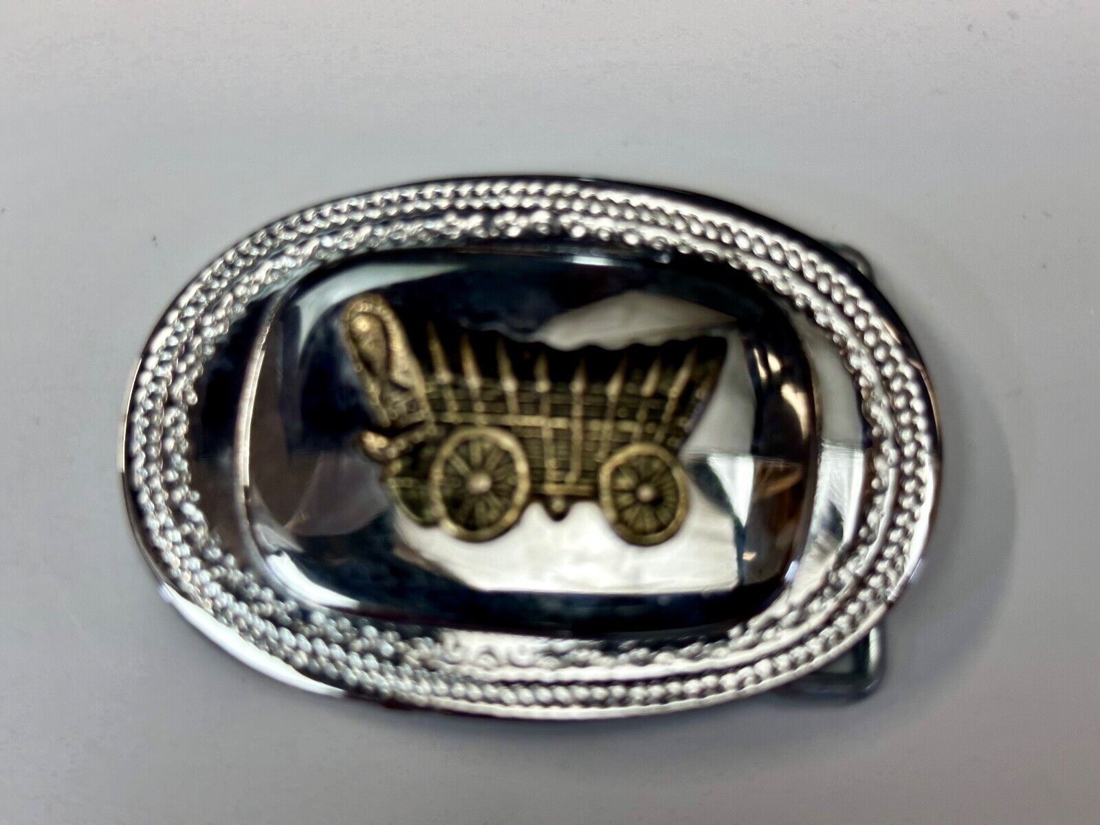 70s Covered Wagon two tone reflective oval ornate boarder belt buckle