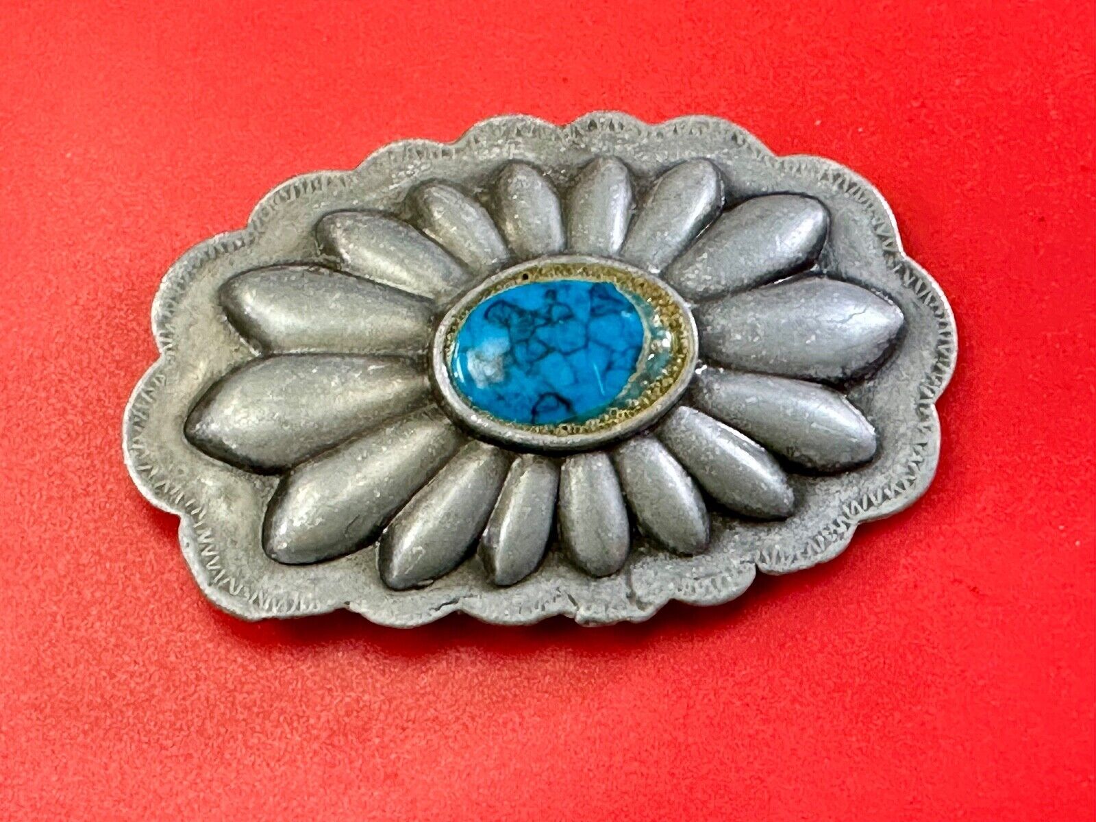 Turquoise stone centered on Vintage metal flower theme belt buckle