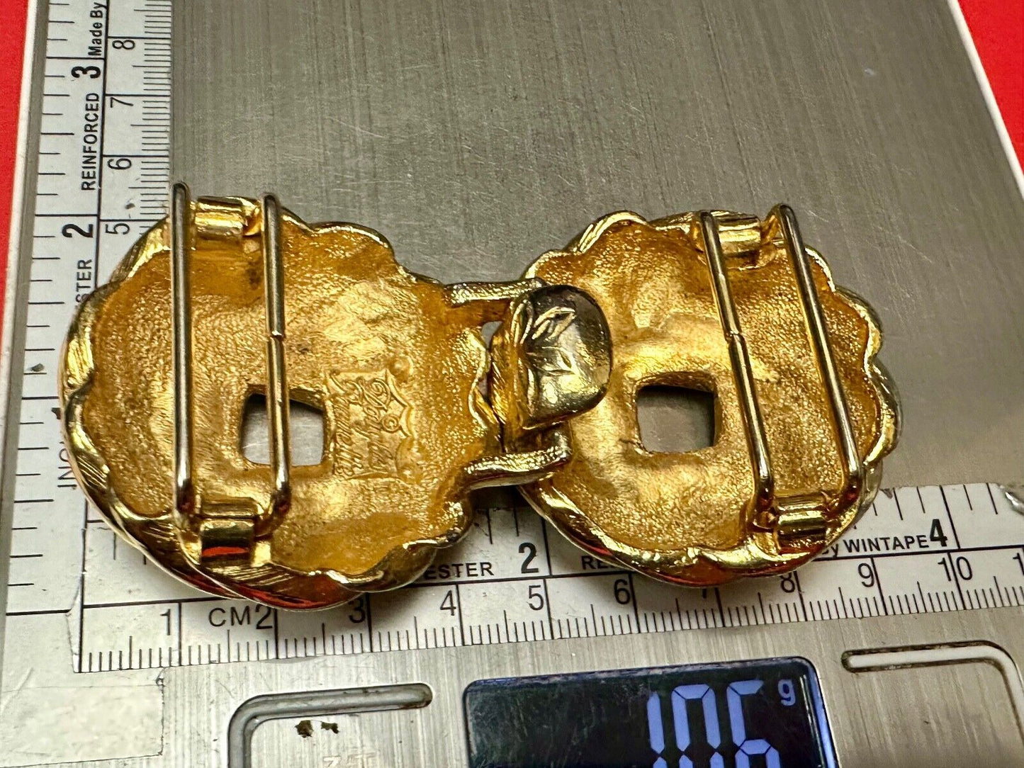Two piece Round Swirl Interlocking gold color belt buckle by Douglas Paquette