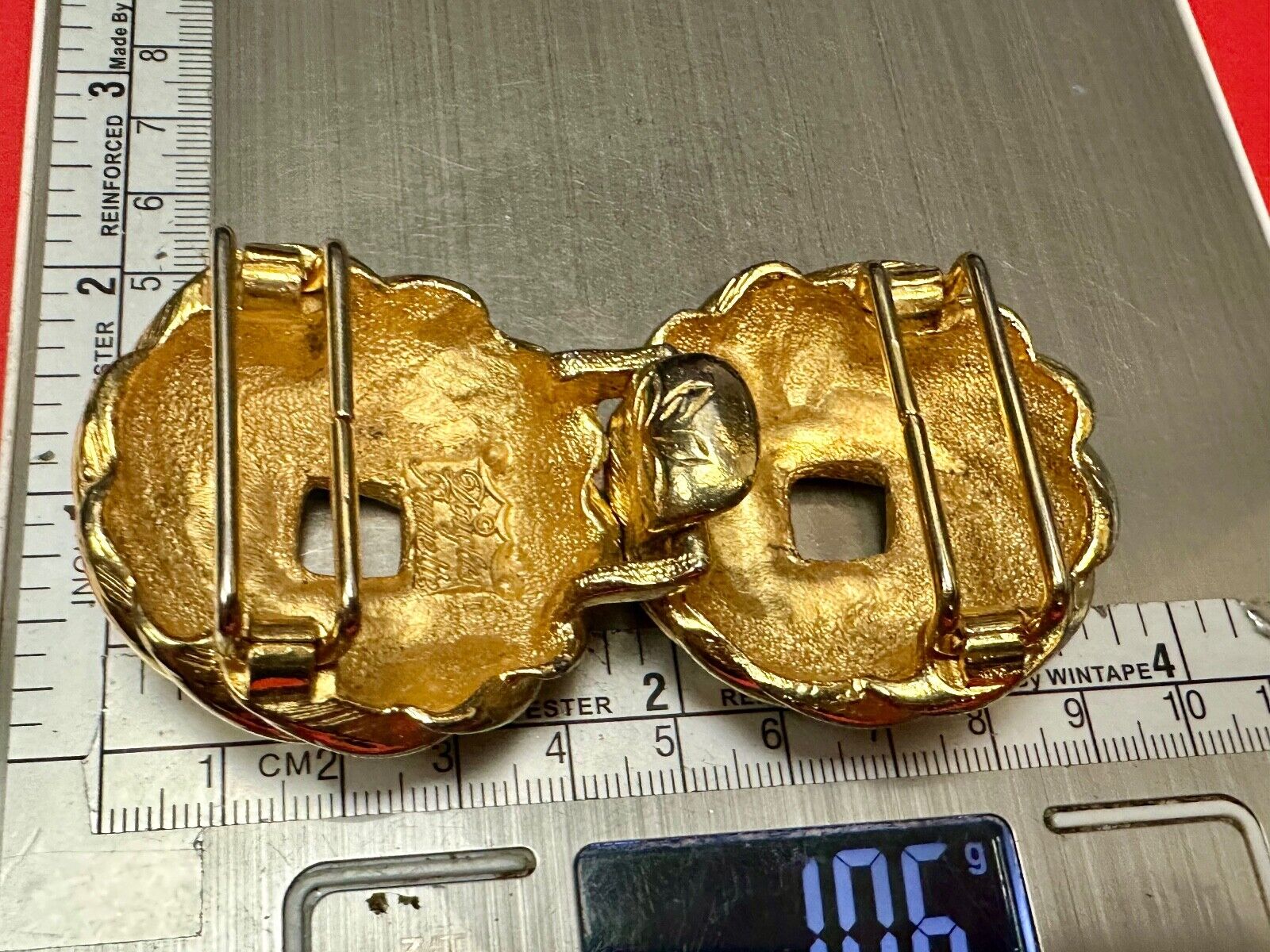 Two piece Round Swirl Interlocking gold color belt buckle by Douglas Paquette