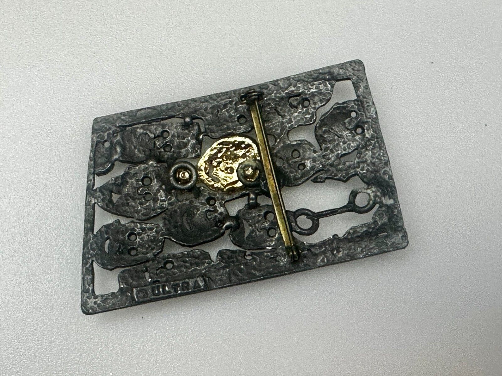 The Standout!  Many Faces in Asymmetric Frame Vintage Pewter Brooch Pin by Ultra