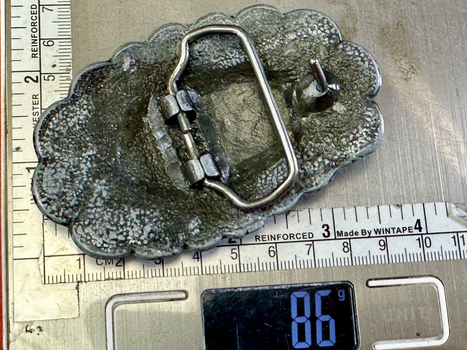 Turquoise stone centered on Vintage metal flower theme belt buckle