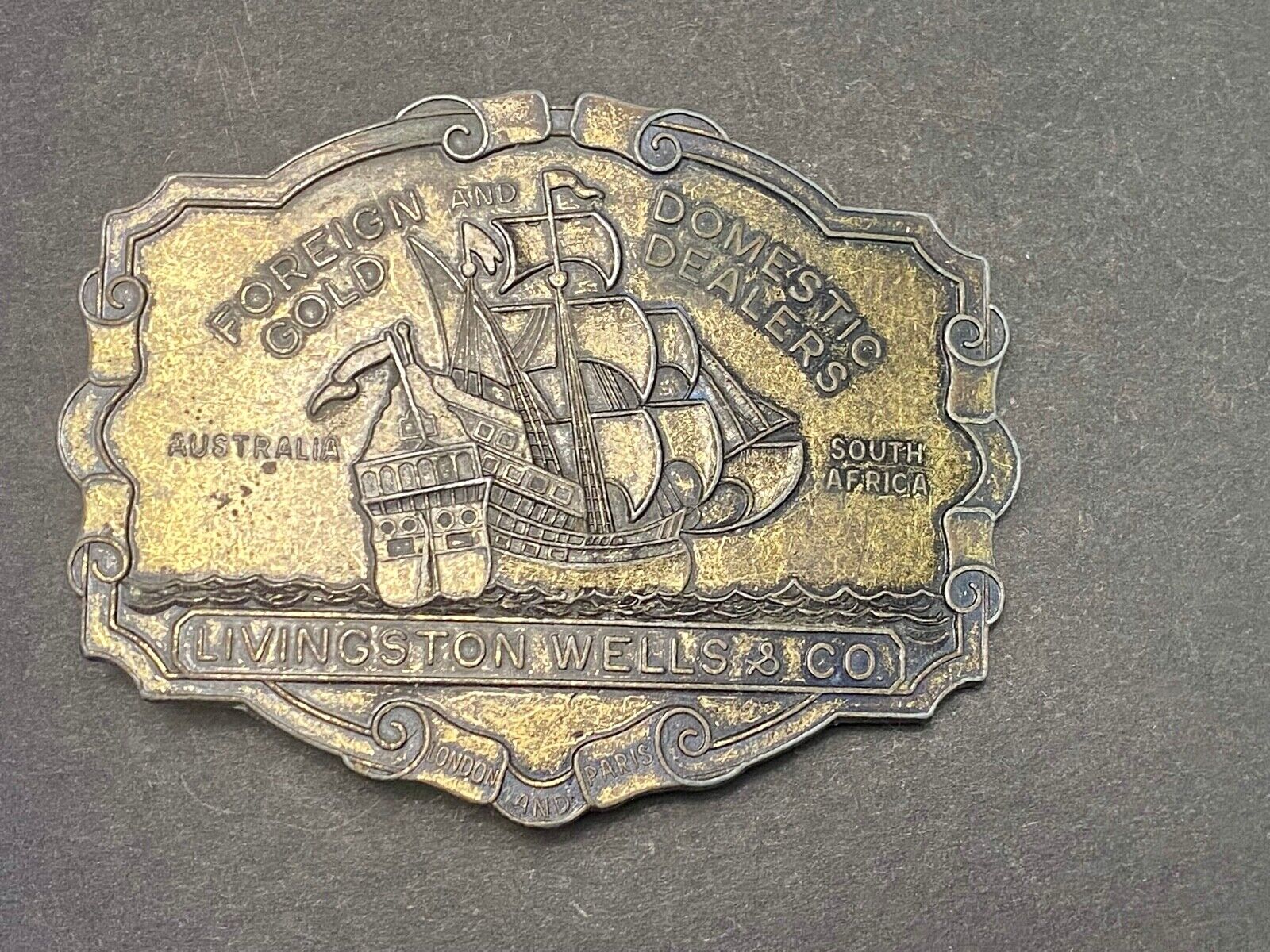 VINTAGE ANTIQUE METAL BELT BUCKLE- Livingston Wells & Co Sailboat Ship