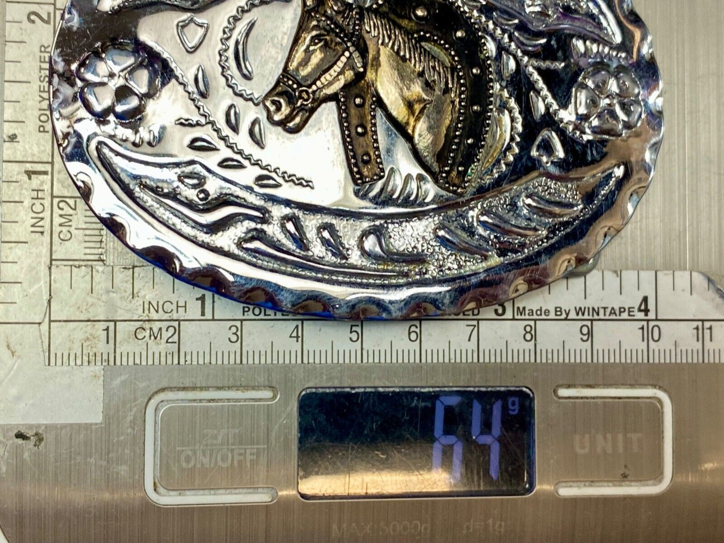 Vintage horse head through lucky horseshoe on mixed metal western belt buckle