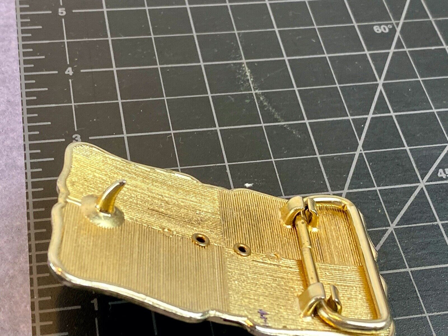 unknown multi layered colored stone as centerpiece in western belt buckle