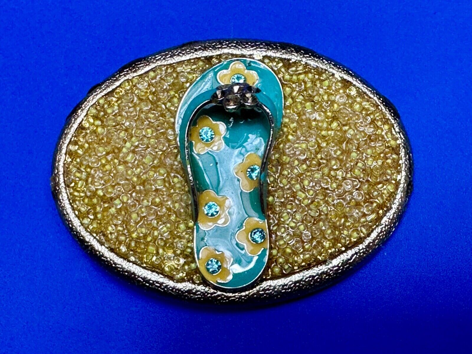unique flip flop on sand - beach girls artisan belt buckle - missing stones?