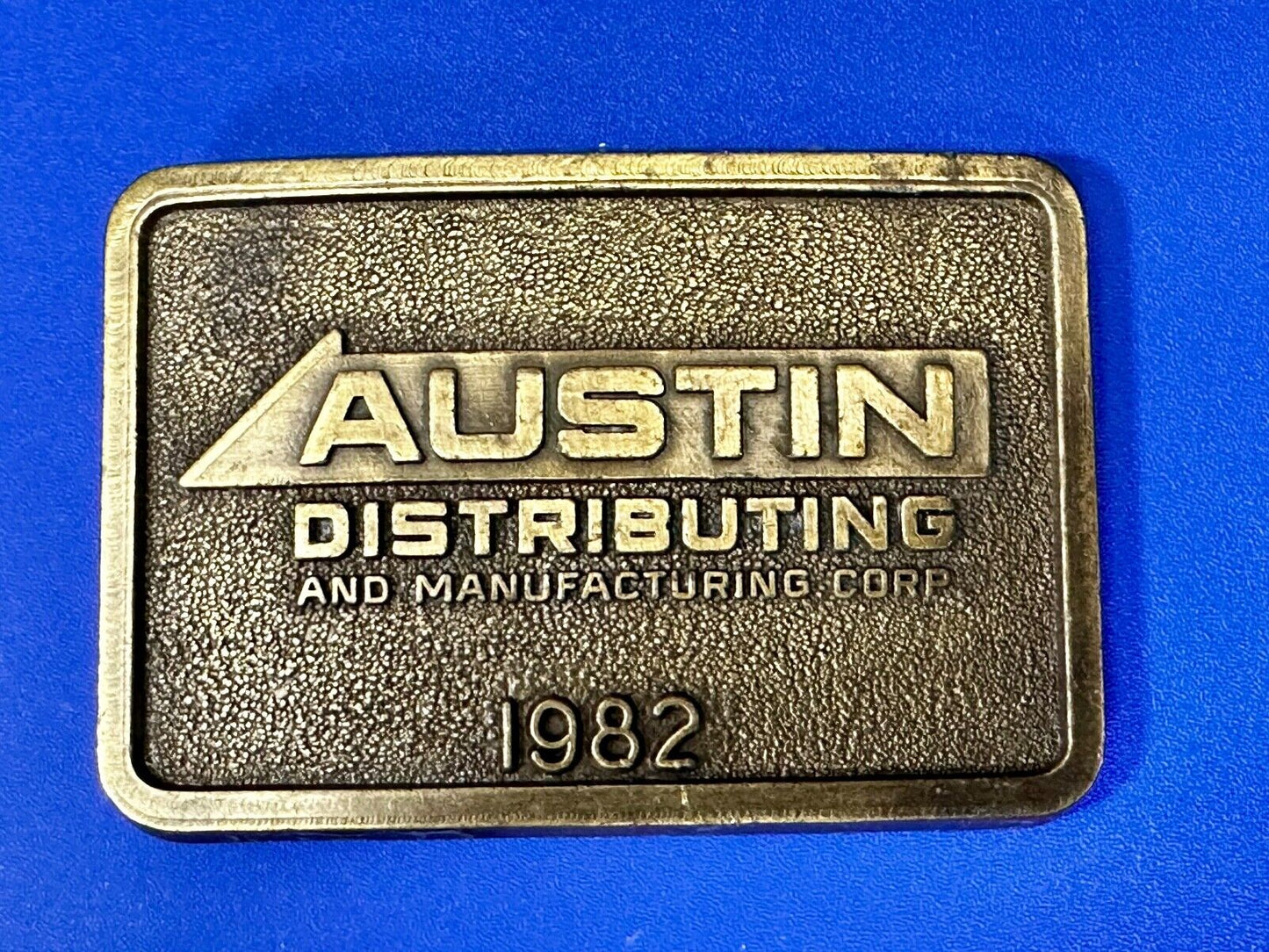 Austin Texas Distributing and Manufacturing 1982 Advertisement Promo Belt Buckle