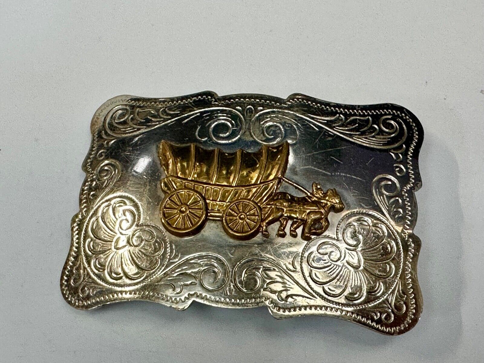 Vintage Covered Wagon two tone ornate cowboys out west flower swirl belt buckle