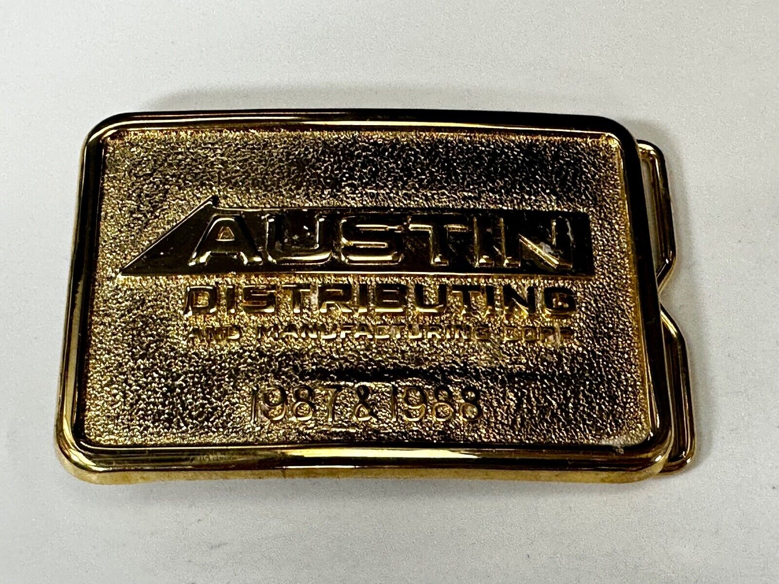 Austin Texas Distributing and Manufacturing 1987 - 1988 Gold Tone Belt Buckle