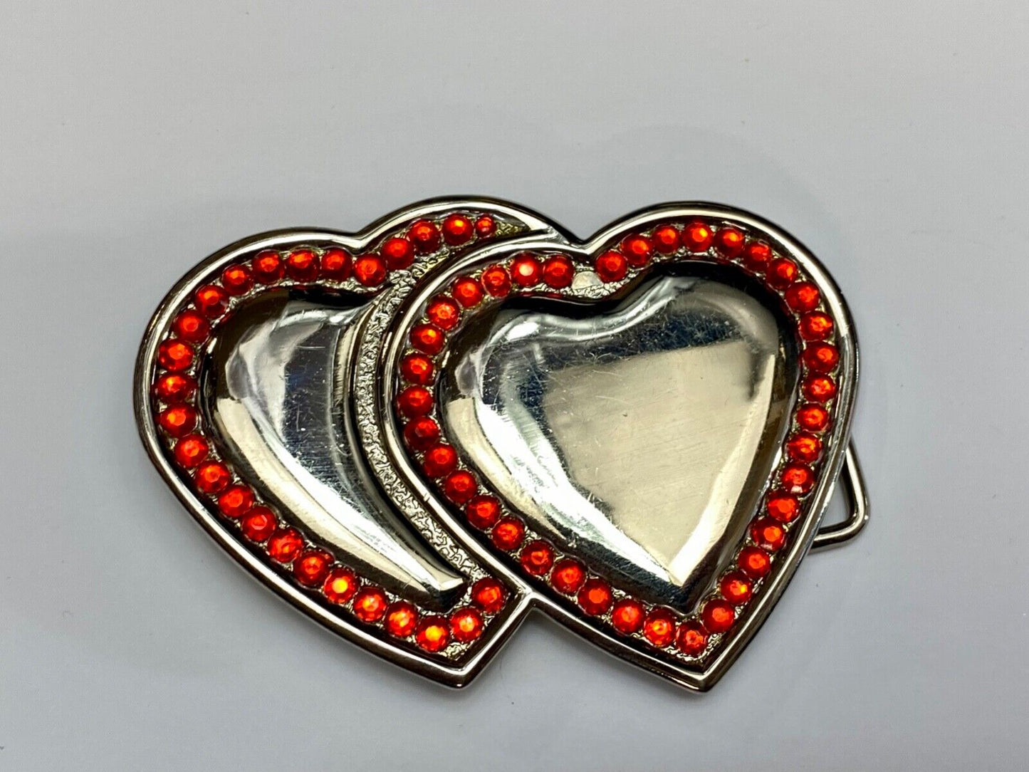 Two Jeweled Hearts Red Rhinestone outlining silver tone cutout belt buckle