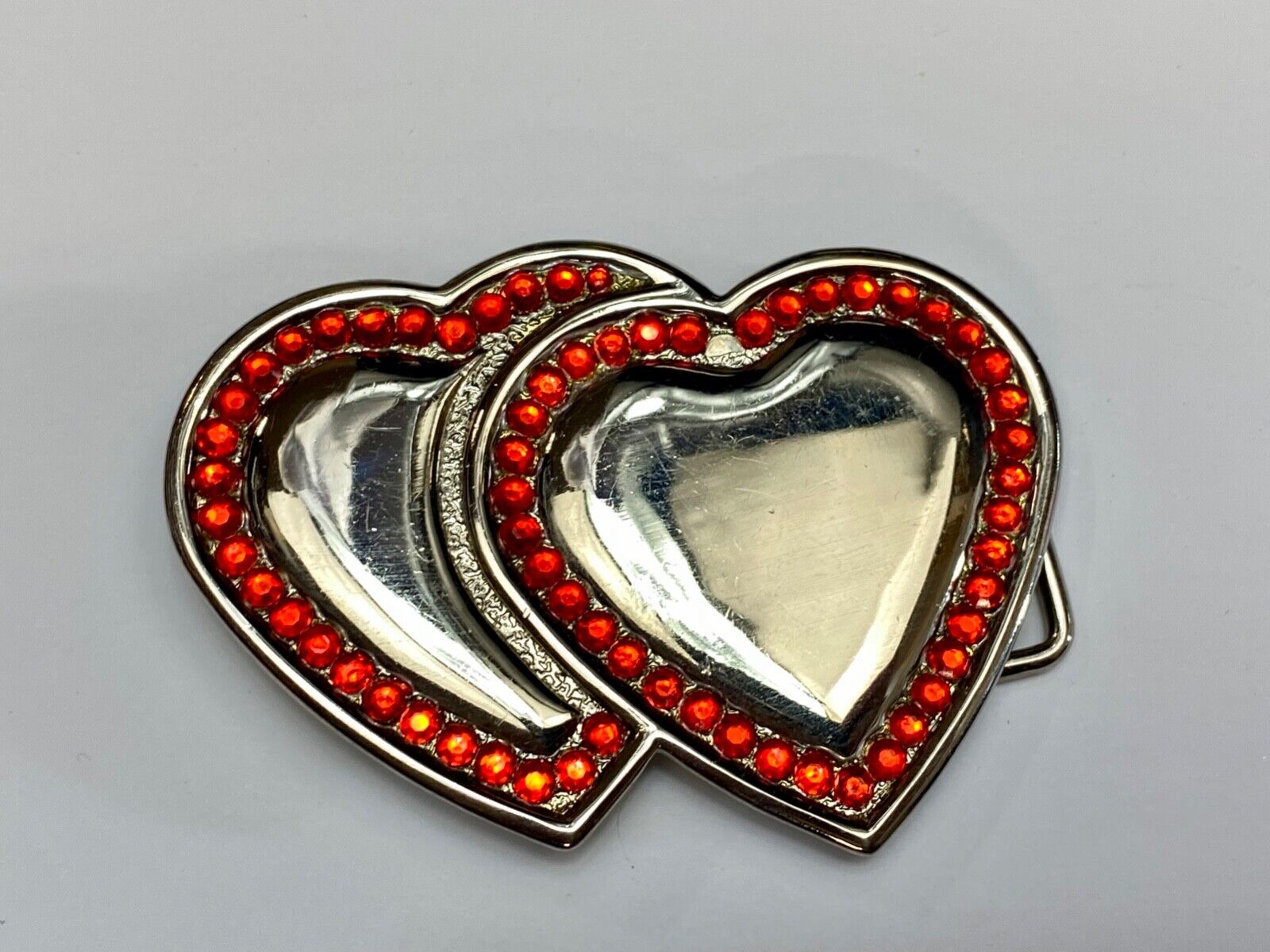 Two Jeweled Hearts Red Rhinestone outlining silver tone cutout belt buckle