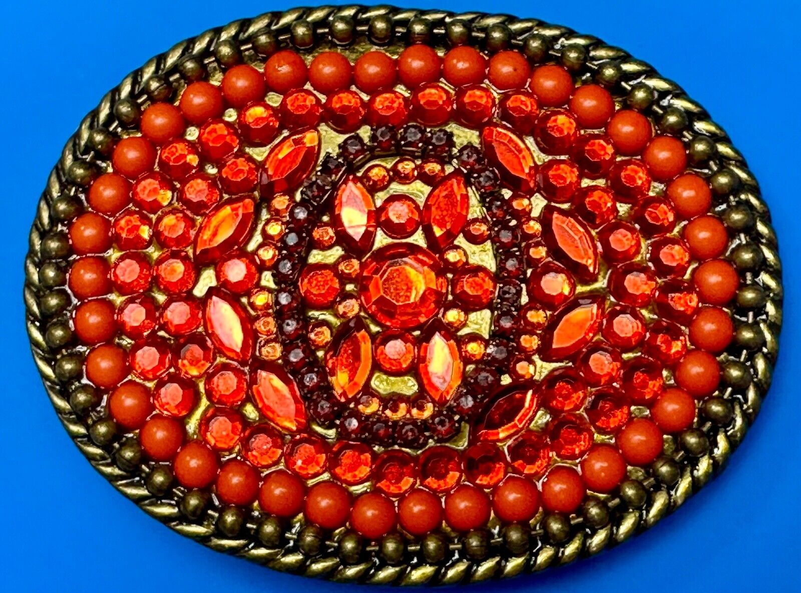 Unique Shades of Red - Mixed Materials oval outlined Belt Buckle