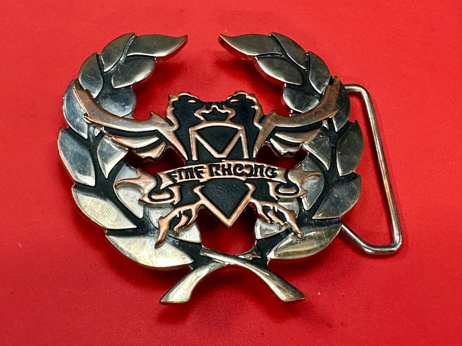 Two griffins?  FME RheJNG Olive branch cutout belt buckle