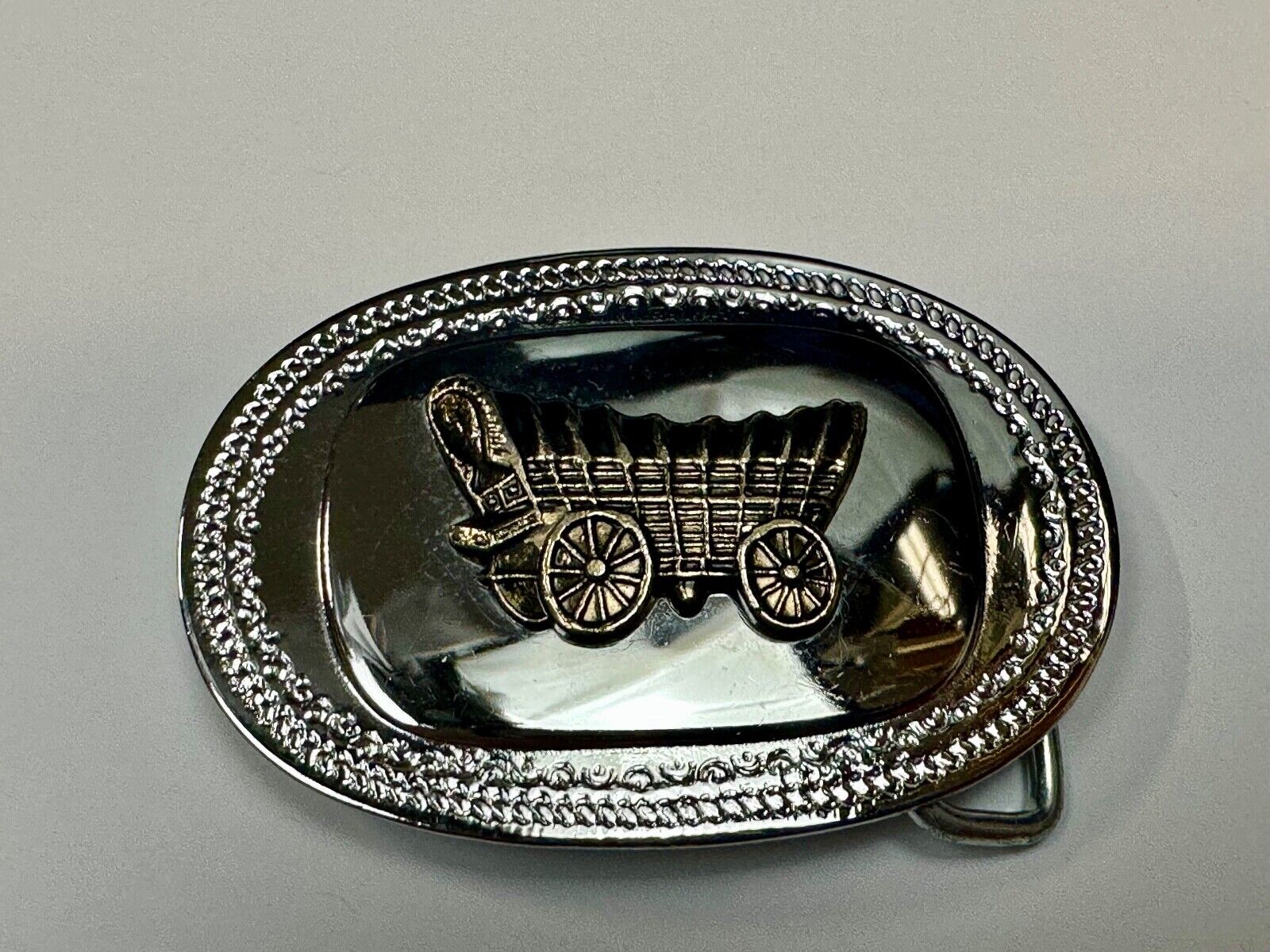 Vintage Covered Wagon on reflective oval two tone western belt buckle