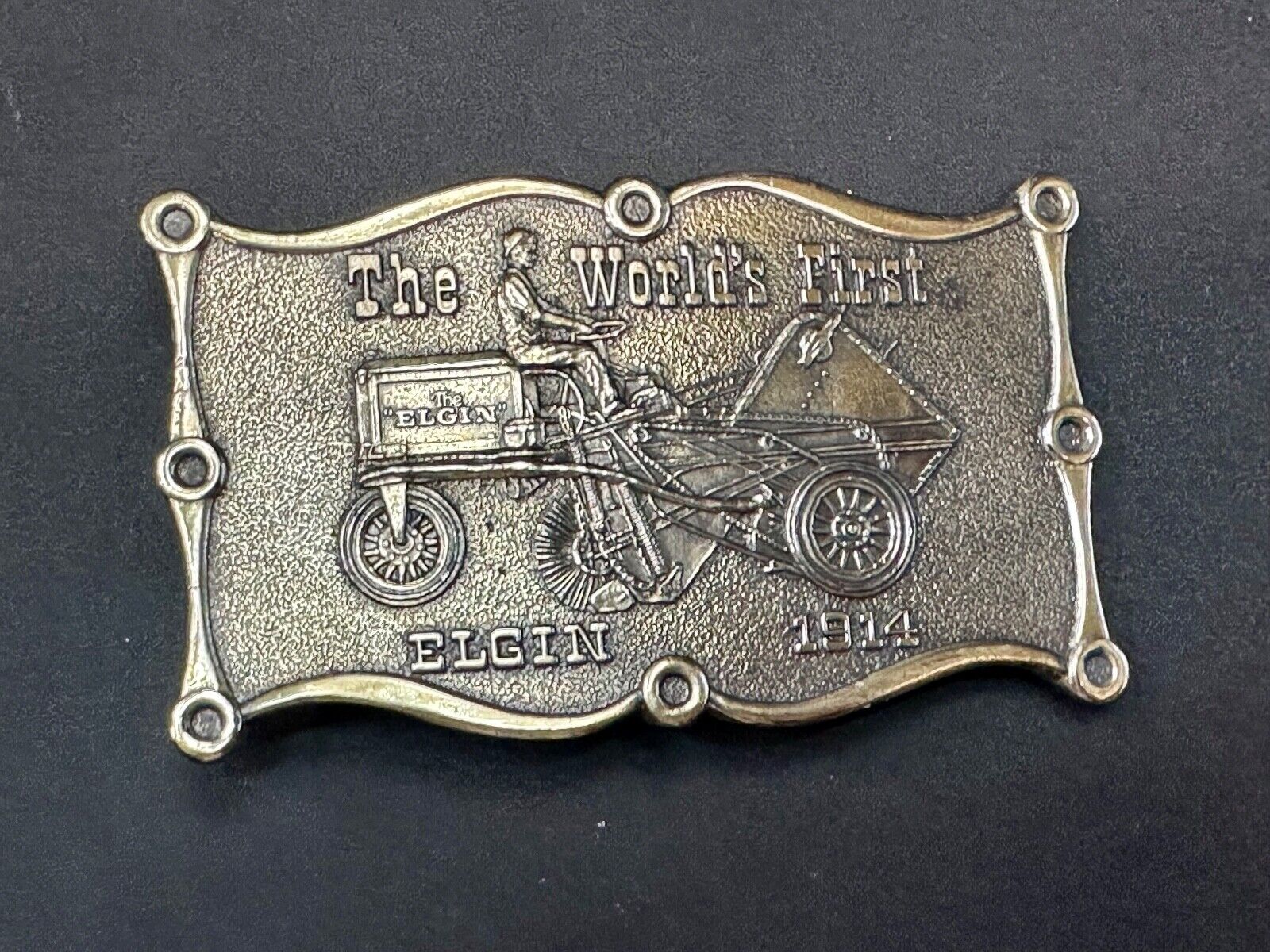The Elgin, The worlds first tree sweeper commemorative belt buckle by Lewis
