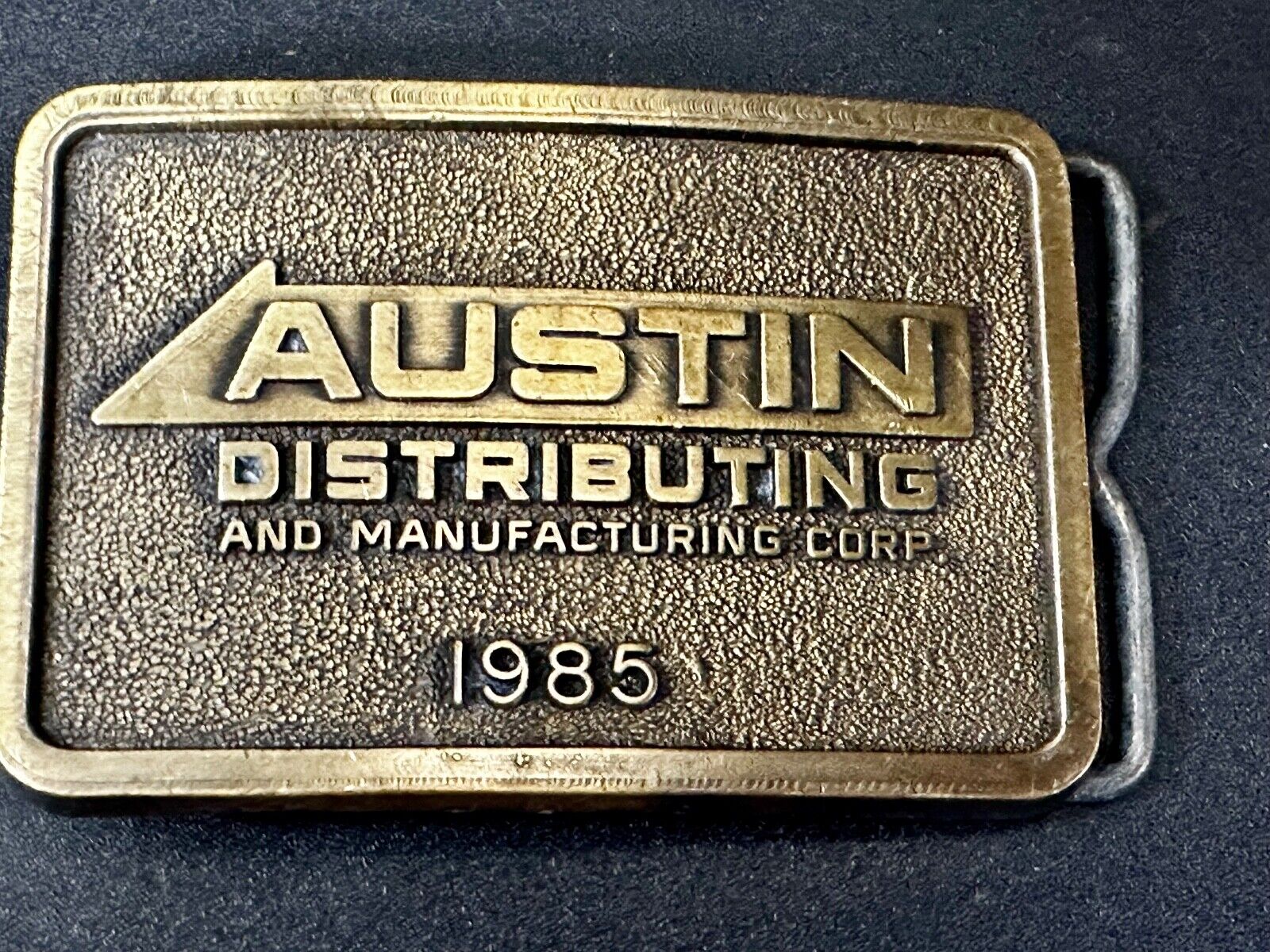 Austin Texas Distributing and Manufacturing 1985 Advertisement Promo Belt Buckle