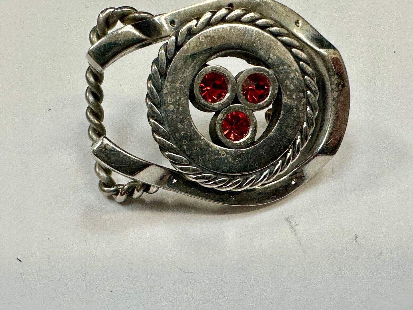 artisan circle pattern rope centerpiece red dots horseshoe shaped belt buckle