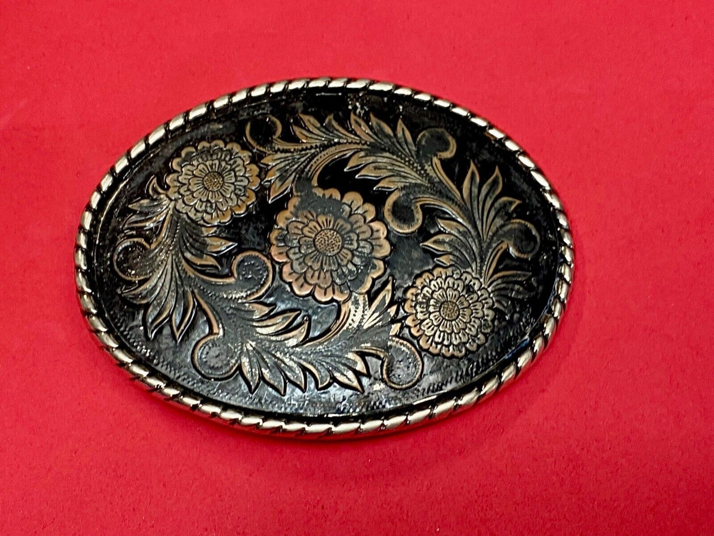Beautiful flower design black & copper color oval outlined western belt buckle W