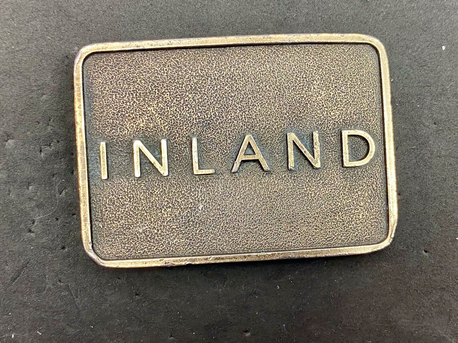 Vintage Inland company belt buckle - truck parts company 