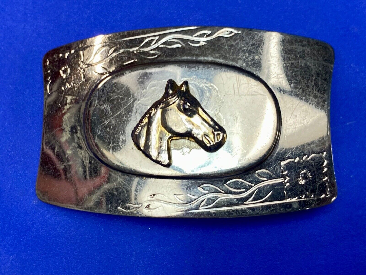 Vintage horse head on western belt buckle
