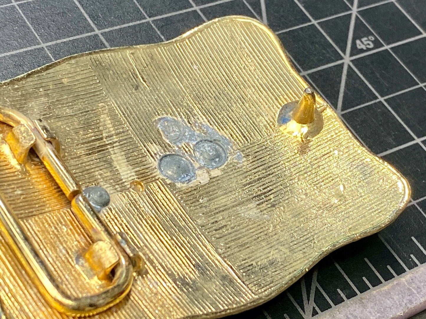 bull riding rodeo cowboy on beautiful gold color flower swirl belt buckle 