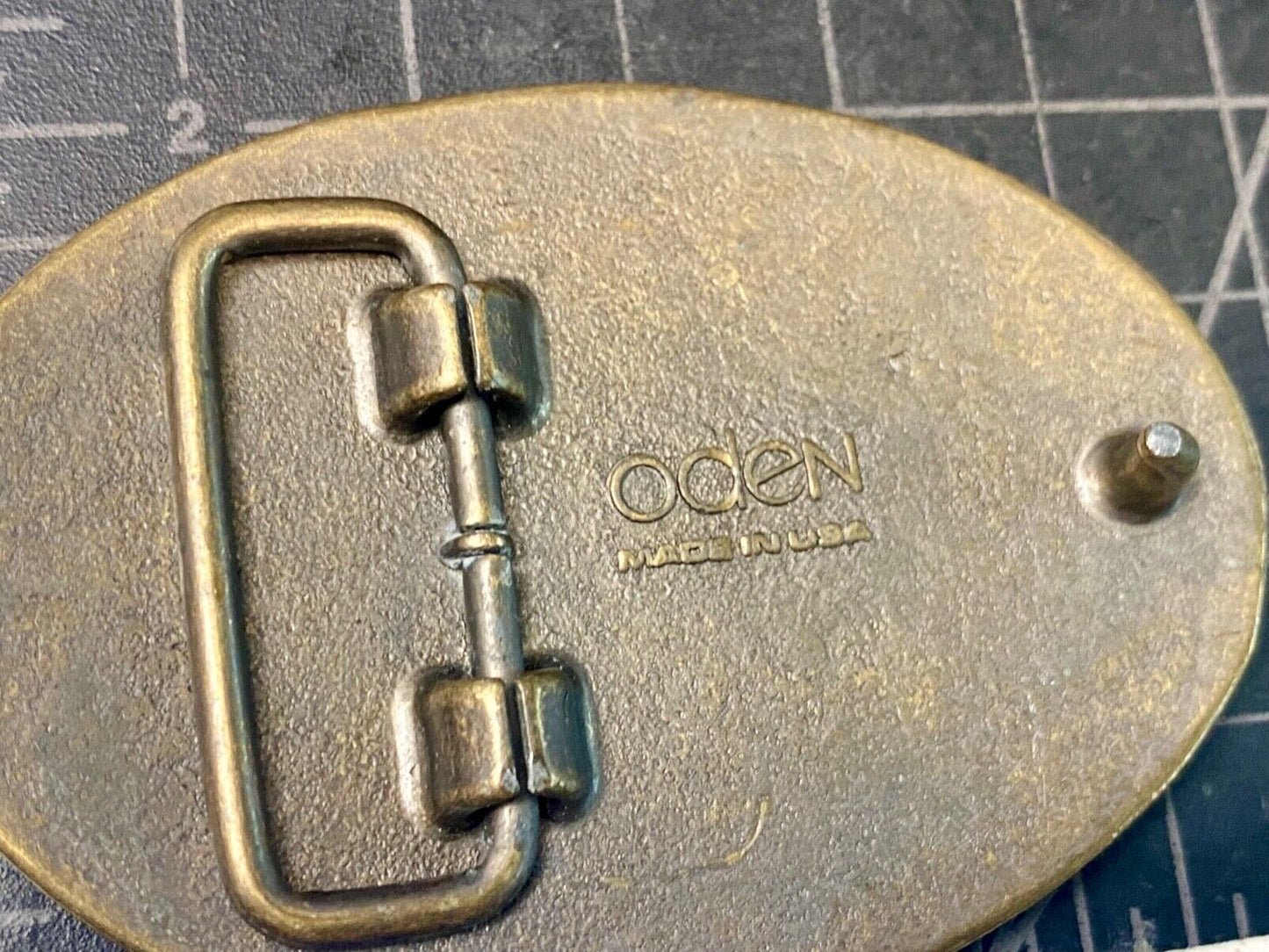 Vintage GREG name metal wood grain western Belt Buckle By Oden - Made In USA