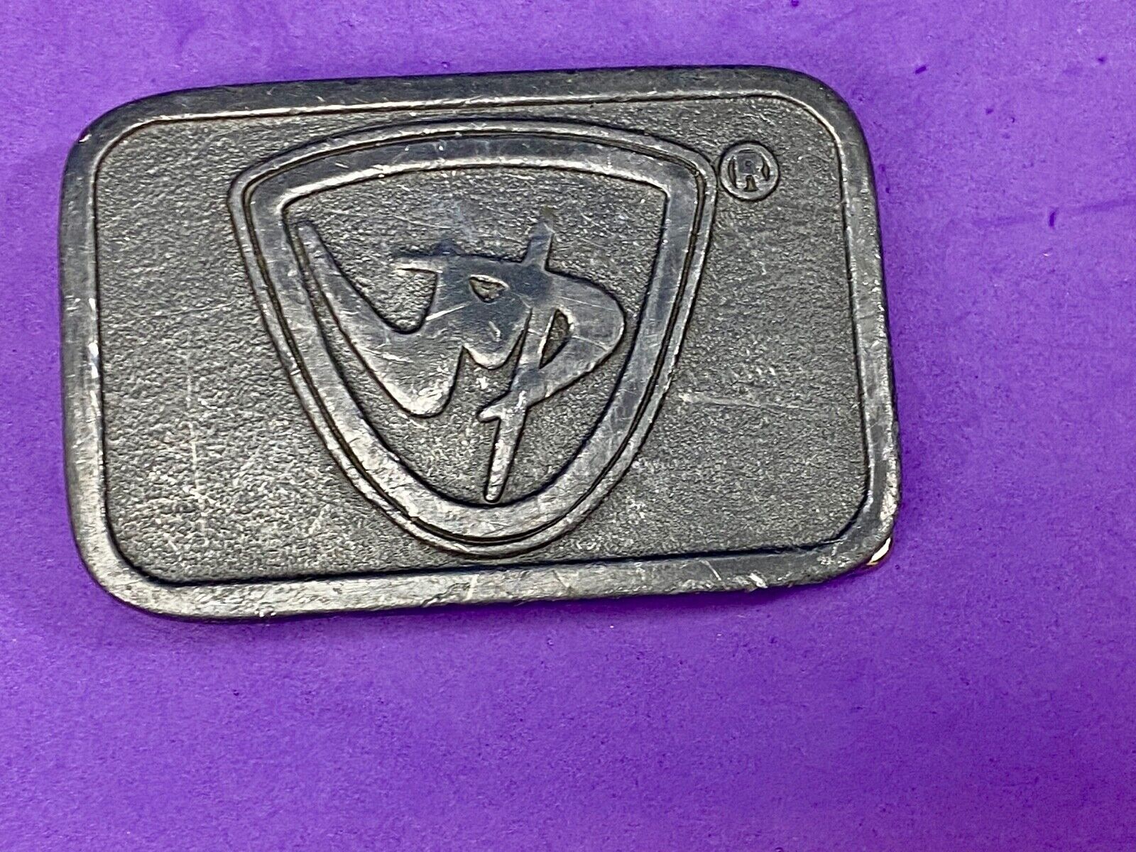 unknown to me, vintage metal belt buckle by HitLine INC.   Company Logo?
