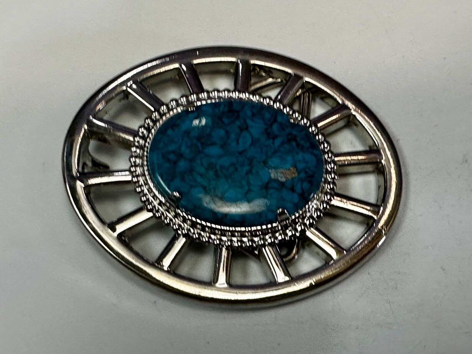 Synthetic Turquoise in unique see through silver tone round Belt Buckle