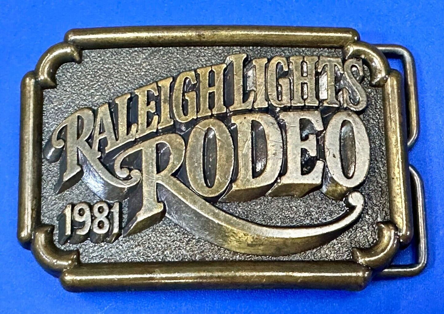 Vintage 1981 RALEIGH LIGHTS RODEO CIGARETTES SPONSOR Brass tone belt buckle