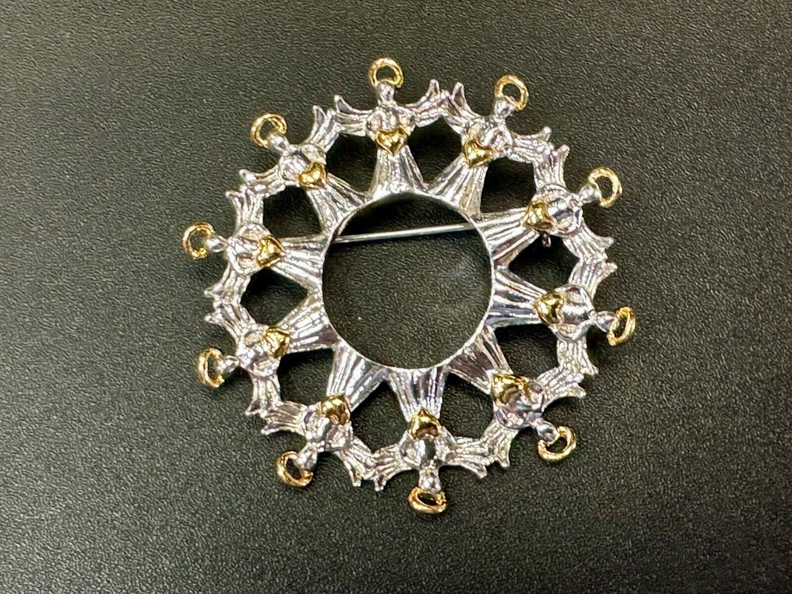 Angles in Circular pattern holiday wreath Avon signed vintage brooch pin