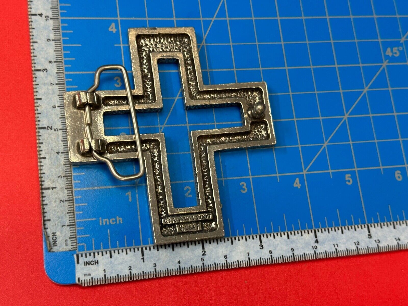 A.P.W. 2007 cross cutout silver tone belt buckle