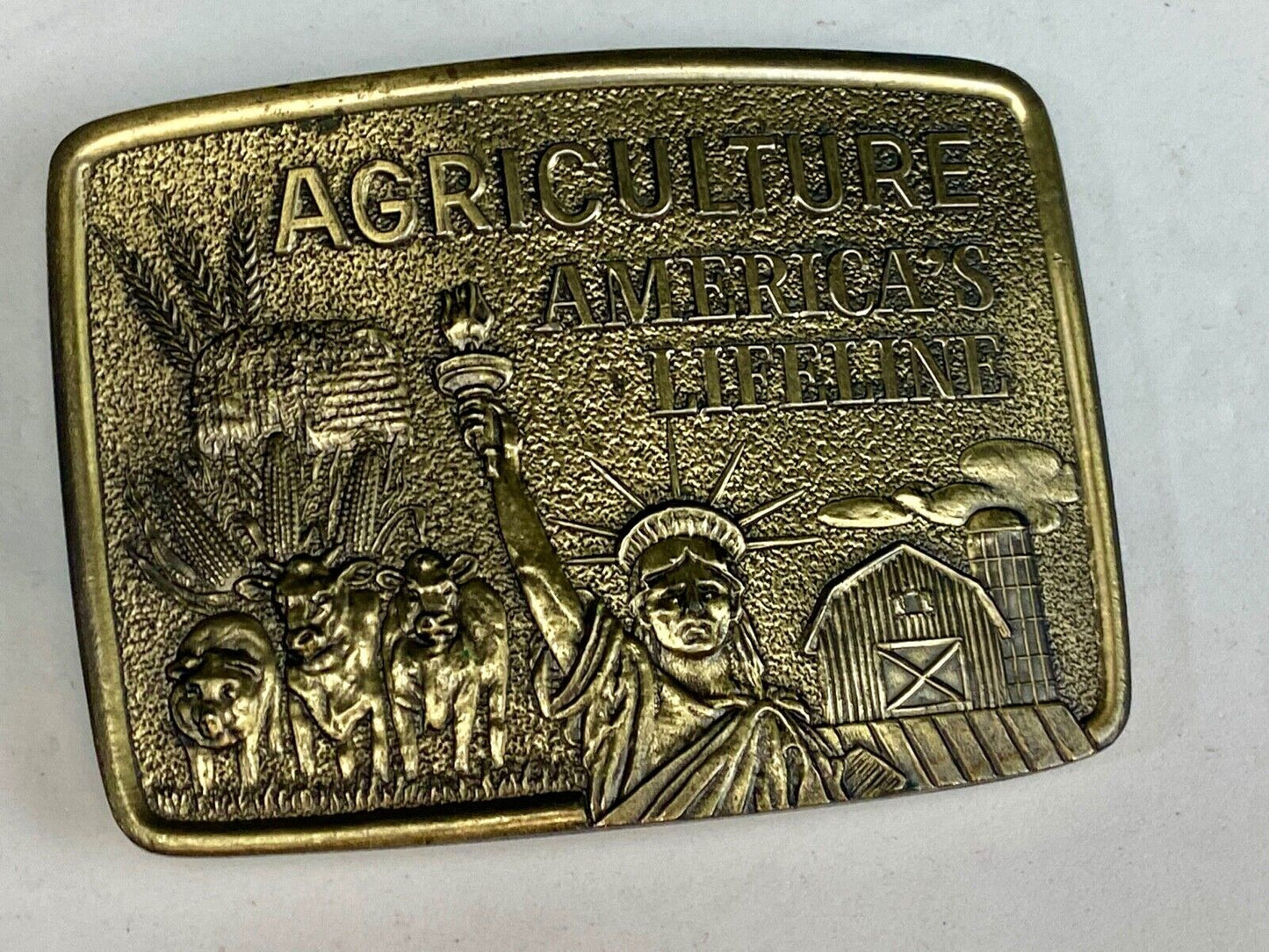 AGRICULTURE, Americas Lifeline belt buckle by Farmhand Statue of liberty 
