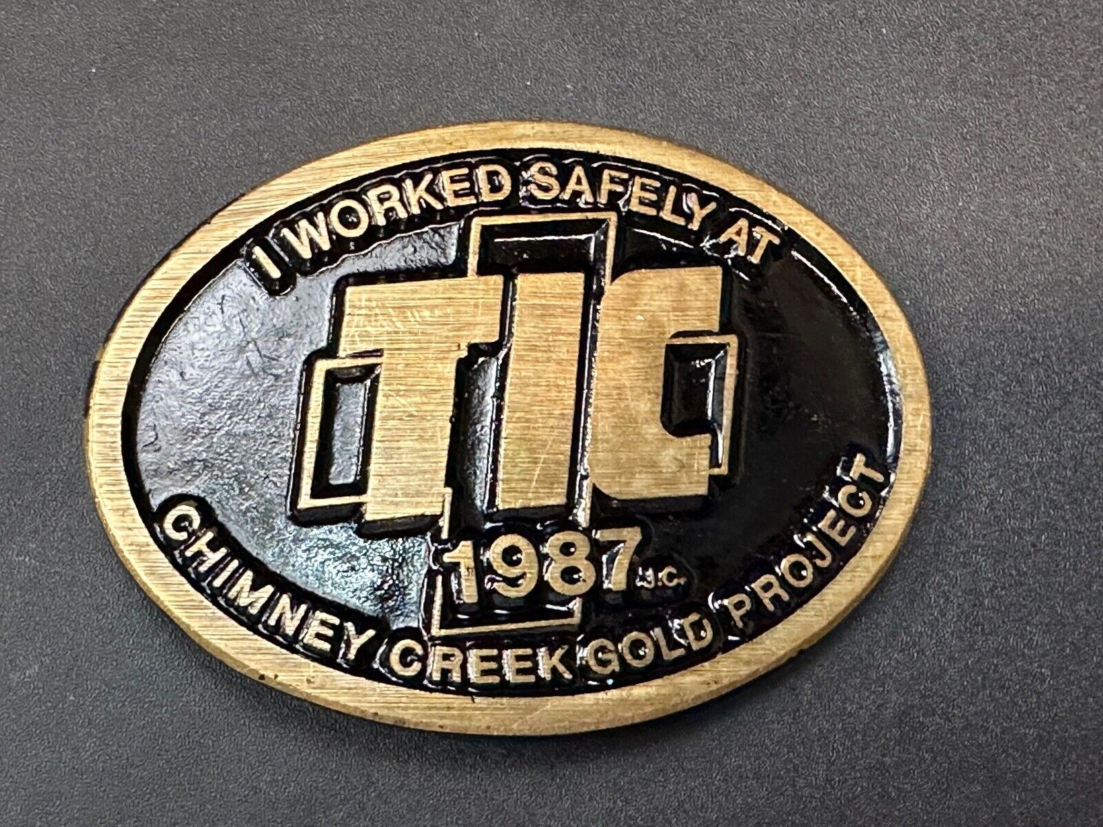 Vintage 1987 TIC Chimney Creek Gold Project Safety award brass belt buckle