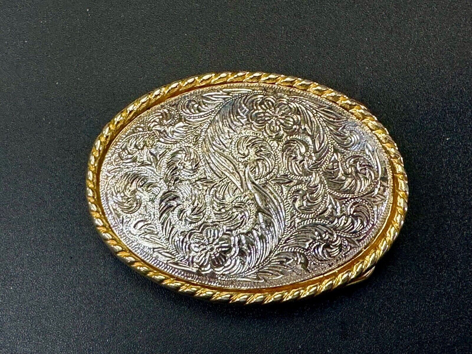 vintage Ivan Brand western flower swirl design two tone oval belt buckle