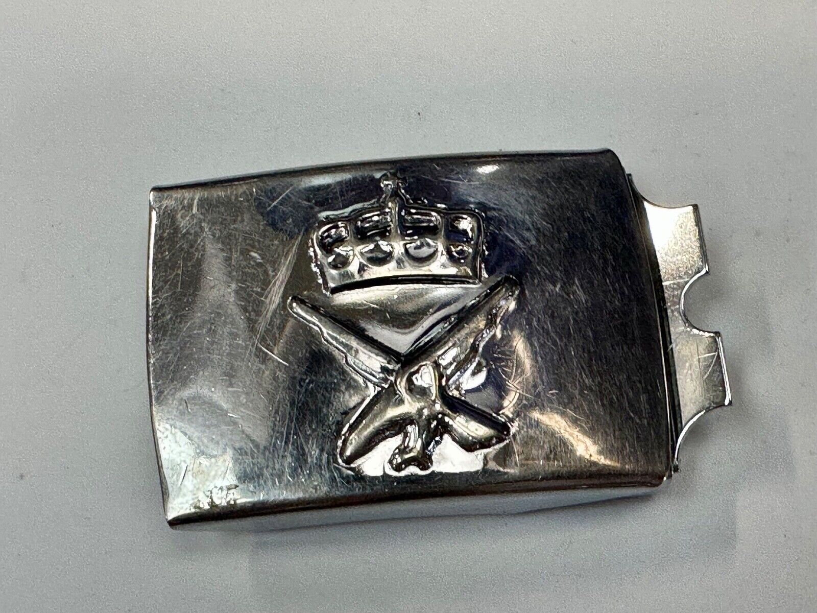 unknown to me!   dress style silver tone crown X crest? stamped belt buckle