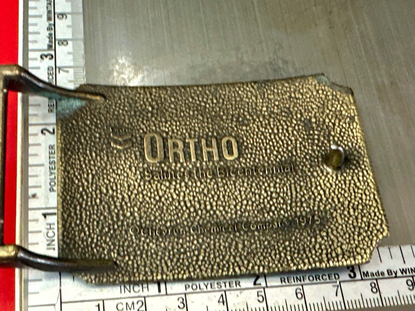 American Agriculture Bicentennial Celebration Ortho sponsored belt buckle