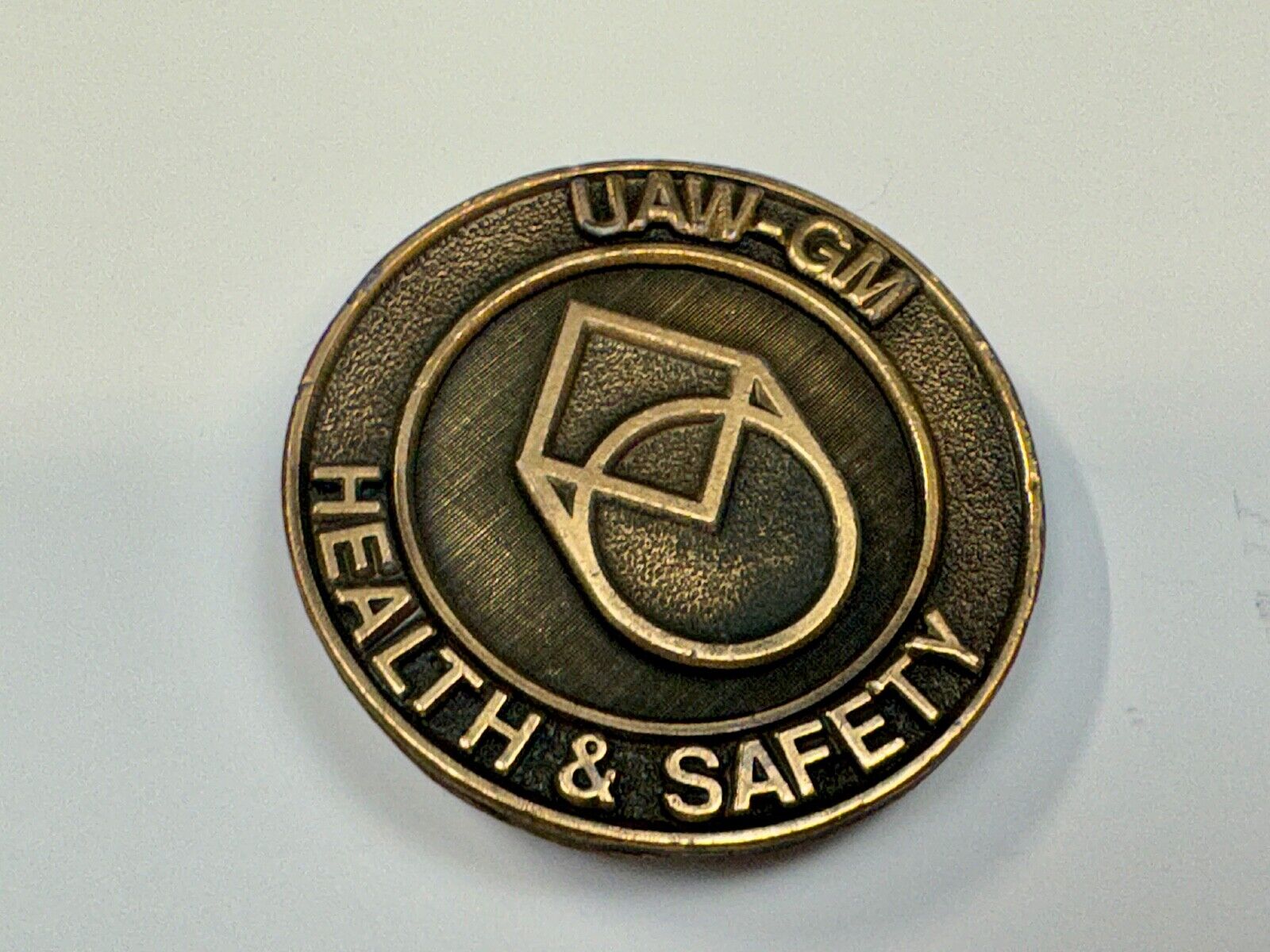 UAW-GM auto workers union round Health & Safety Award belt buckle